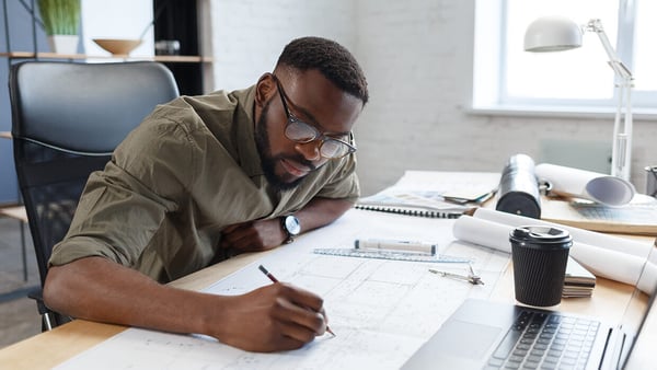 Markets-Architects-Man-with-Drawings