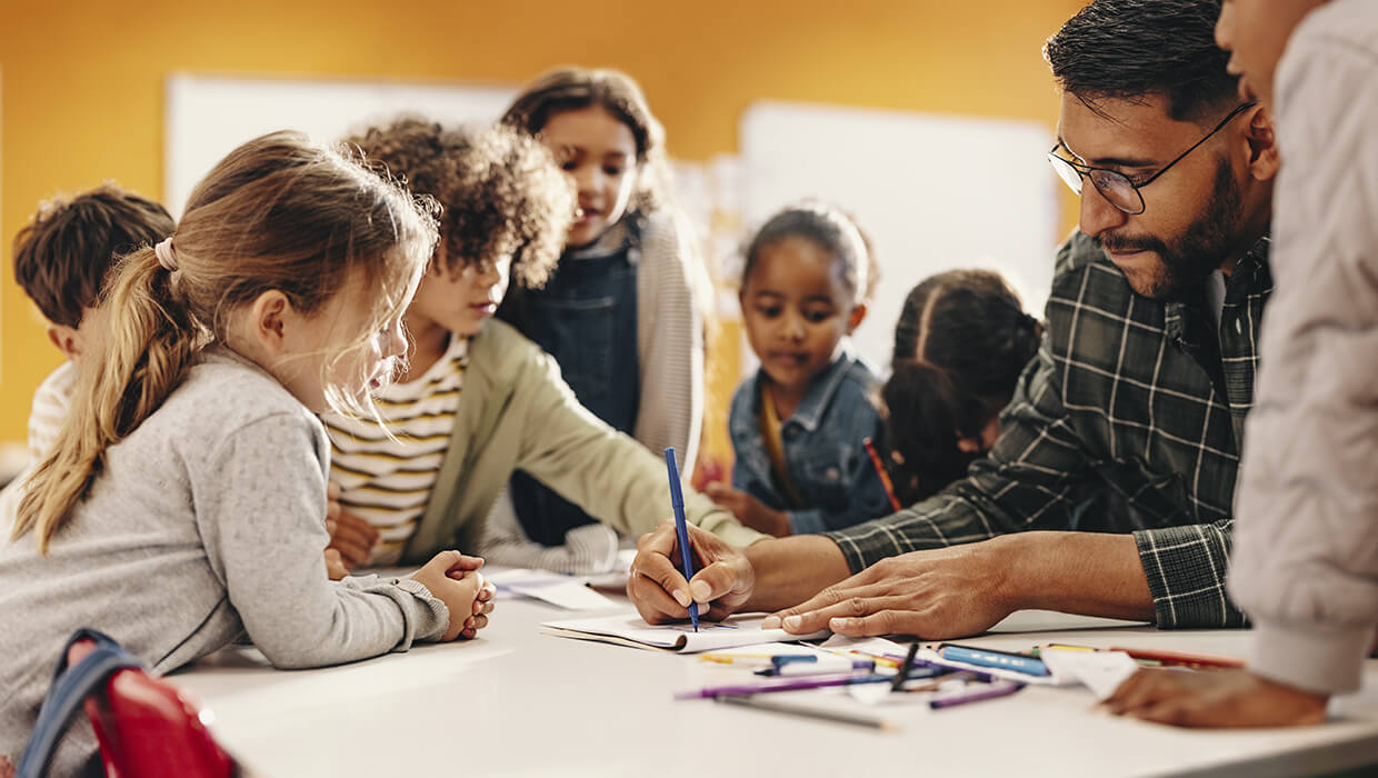 Markets-Education-Male-Teacher-with-Elementary-Students