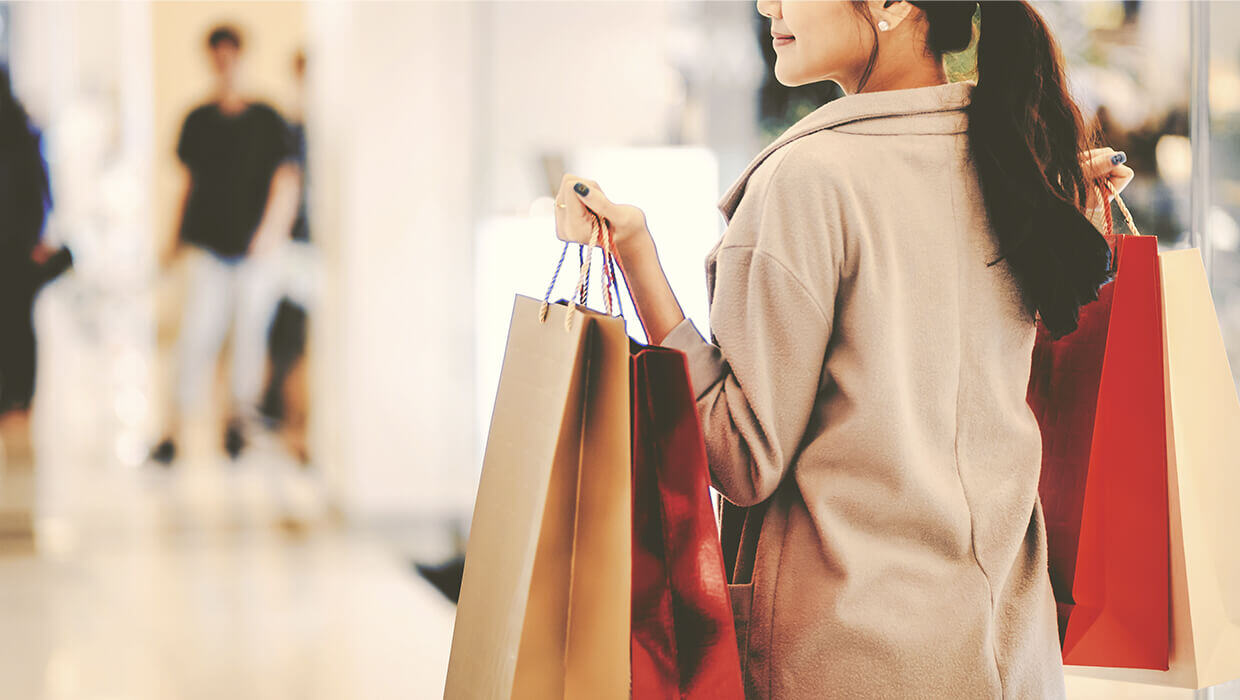Markets-Retail-and-Restaurants-Woman-with-Shopping-Bags